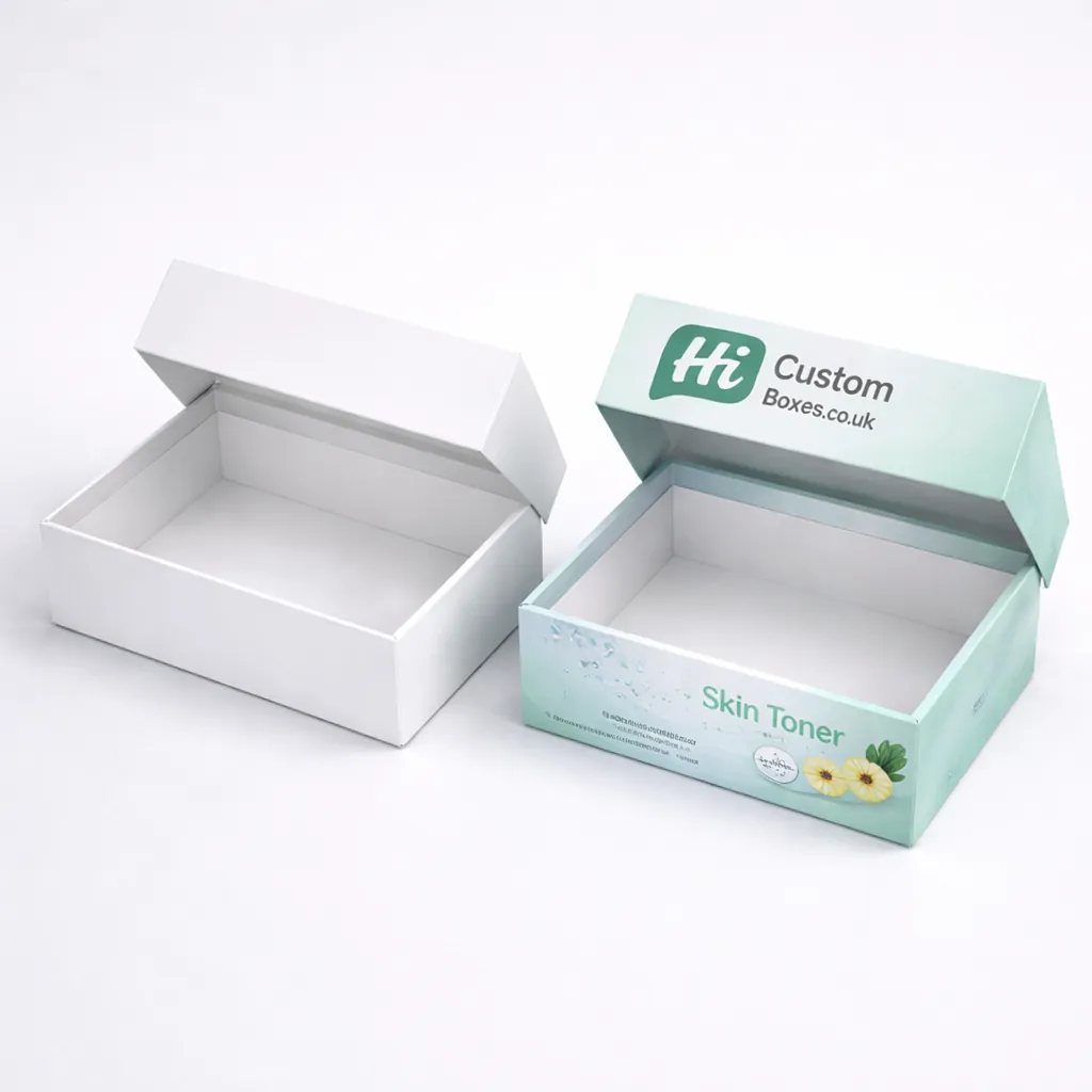 Two white hanging tab boxes, one plain and one with blue medical skin toner labelling. class=